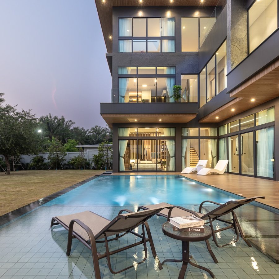 Sylva — villa facade and pool at twilight